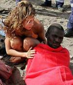 Sunbather-cum-lifesaver on Canary Island beach (AP)