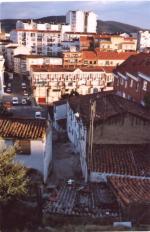 Gypsy homes in the shadow of more recent development (CJM)